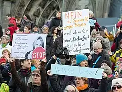 Protesters gather outside Cologne Cathedral after New Year's Eve sexual assaults in Germany, January 2016