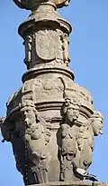 Detail of spouts, showing figures and coat-of-arms