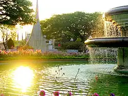 Fountain in Barão de Araras Square with the 100th Anniversary City Monument at the back