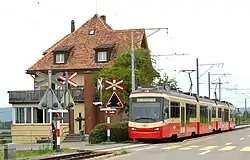 A train on roadside single track near Neue Forch station