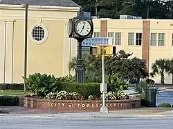 Clock and buildings in Forrest Acres