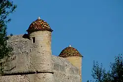 The two stone sentry boxes on the South side.