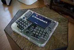 Framedeck, a Framework motherboard based cyberdeck with clear acrylic and brass influenced by TRS-80 Model 100[149][150]