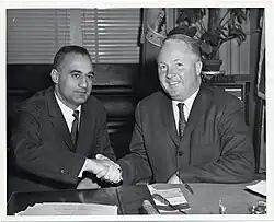 Bellotti shakes hands with Boston Mayor John F. Collins in Collins's office at the Old Boston City Hall (circa 1962)