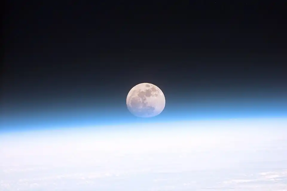 Image 26Astronauts aboard the Space Shuttle Discovery recorded this rarely seen phenomenon of the full Moon partially obscured by the atmosphere of Earth. The image was recorded with an electronic still camera at 15:15:15 GMT, Dec. 21, 1999. (Credit: NASA.) (from Portal:Earth sciences/Selected pictures)