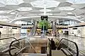 Second floor elevators and luxury shops of Terminal 1