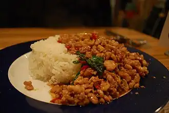 Steamed jasmine rice with holy basil and chicken stir fry