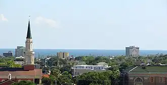 An arial photograph of a city near a coast
