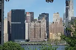 Looking across at Tudor City between 40th and 42nd Streets from Queens. The black building to the left is 685 First Avenue, which has a black facade and a niche.