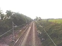 Electrification return wires west of Garswood station towards St. Helens Central, May 2014