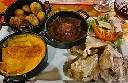 Dishes served in an estaminet in Lille (potatoes, carbonade flamande, welsch, potjevleesch).