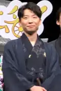 Gen Hoshino at a test screening in 2019 wearing traditional Japanese clothing.