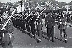 General Robert L. Eichelberger and inspects Australian Guard of Honour at Kure.