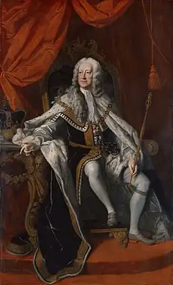 George sitting on a throne