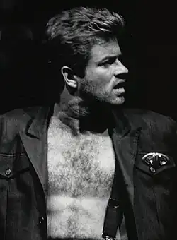 Black and white portrait of George Michael onstage
