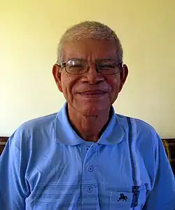 Guillermo Arévalo Valera wearing a blue polo shirt, smiling at camera