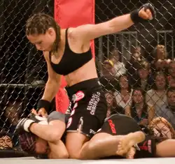 Image 40Gina Carano applying a ground-and-pound on her opponent (from Mixed martial arts)