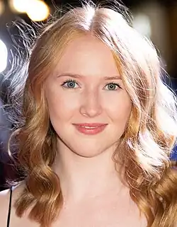 Close-up of Gina Alice Stiebitz, smiling directly at camera