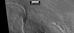 Possible moraine on the end of a past glacier on a mound in Deuteronilus Mensae, as seen by HiRISE, under the HiWish program. Location of this image is the box labeled A in previous image.