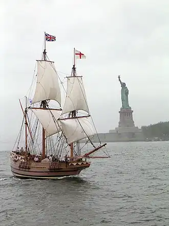 Replica of early 17th century English ship Godspeed, with Union flag in her “main-toppe” and that of England in her “fore-toppe”