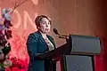 Governor Maura Healey wearing a pantsuit during a speech, May 2025