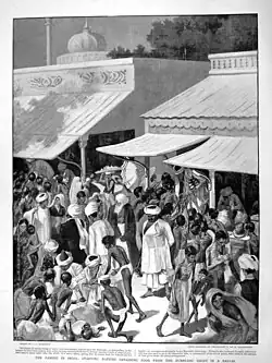 Drawing, titled "Famine in India," from The Graphic, February 27, 1897, showing a bazaar scene in India with shoppers, many of whom are emaciated, buying grain from a merchant's shop