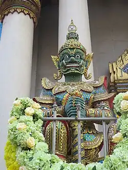 Guardian figure (yaksha) at the entrance of the main hall