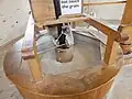 5) Between the millstones, grain is ground to a fine powder (meal)