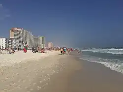 Beach during Spring Break with condominiums and hotels in the background