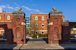 Behind the Vulcan Building, this gateway and wall (c.1802) marks the original perimeter of the site.