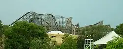 Gwazi as captured from the park's transportation Skyride with the full layout. A Lion train can be seen descending its initial drop.