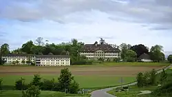 Hofwyl school, Münchenbuchsee, Switzerland, with boarding school on the left and assembly hall on the right