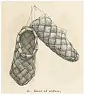 A pair of Finnish traditional shoes woven from strips of birch bark