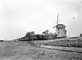 NS 7742 with carriages en route between Bergen and Alkmaar, near the mill in Koedijk; 1953.
