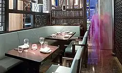 The interior of a restaurant with two tables visible