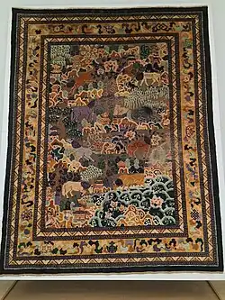 Imperial Chinese carpet depicting "The eight horses of King Mu". China, 19th century, Museum für Kunst und Gewerbe