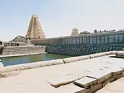 Virupaksha Temple, with the gopuram seen across the temple tank