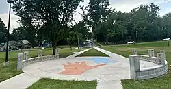 Handprint Plaza was installed in 2024 at Lykins Square Park for neighborhood revitalization.