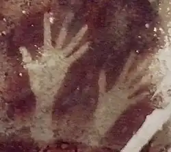 Cave of Pettakere, Bantimurung district (kecamatan), South Sulawesi, Indonesia. Hand stencils estimated between 0,000 years old[53]