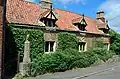 Harlaxton cottage with owl statue