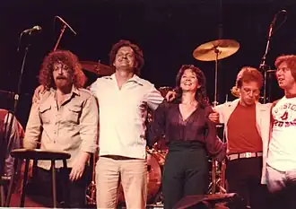 "Big" John: Standing at far left in the photo (with Harry Chapin, next to him) during a curtain call in the 1970s