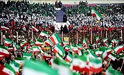 Supporters of Hassan Rouhani waving Islamic Republic flags