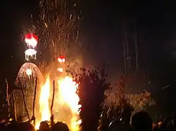 Burning structure at night.