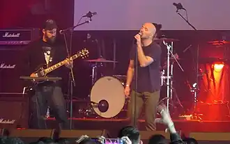 Macuga (left) and Barrett performing in 2019.