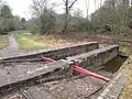 Top of the incline, showing original-pattern bridge rail. The normal water level is shown by the extent of the staining on the wall[3]