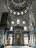 View of the mosque's mihrab (center) and the sultan's loge (upper left)