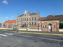 The town hall and schools of Helfaut