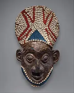 Royal mask; by artists of the Bamum people (Cameroon); before 1880; wood, copper, glass beads, raffia and shells; height: 66&nbsp;cm; Metropolitan Museum of Art[109]