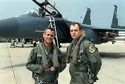 Bodinger and Lt. Col. Ralph Jodice, 335th Fighter Squadron Commander of the United States Air Force, pose in front of an F-15E, March 1994