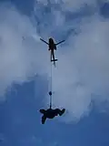 North Shore Rescue HFRS technician performing a flight evolution